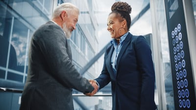 Recruiter shaking hands with new employee